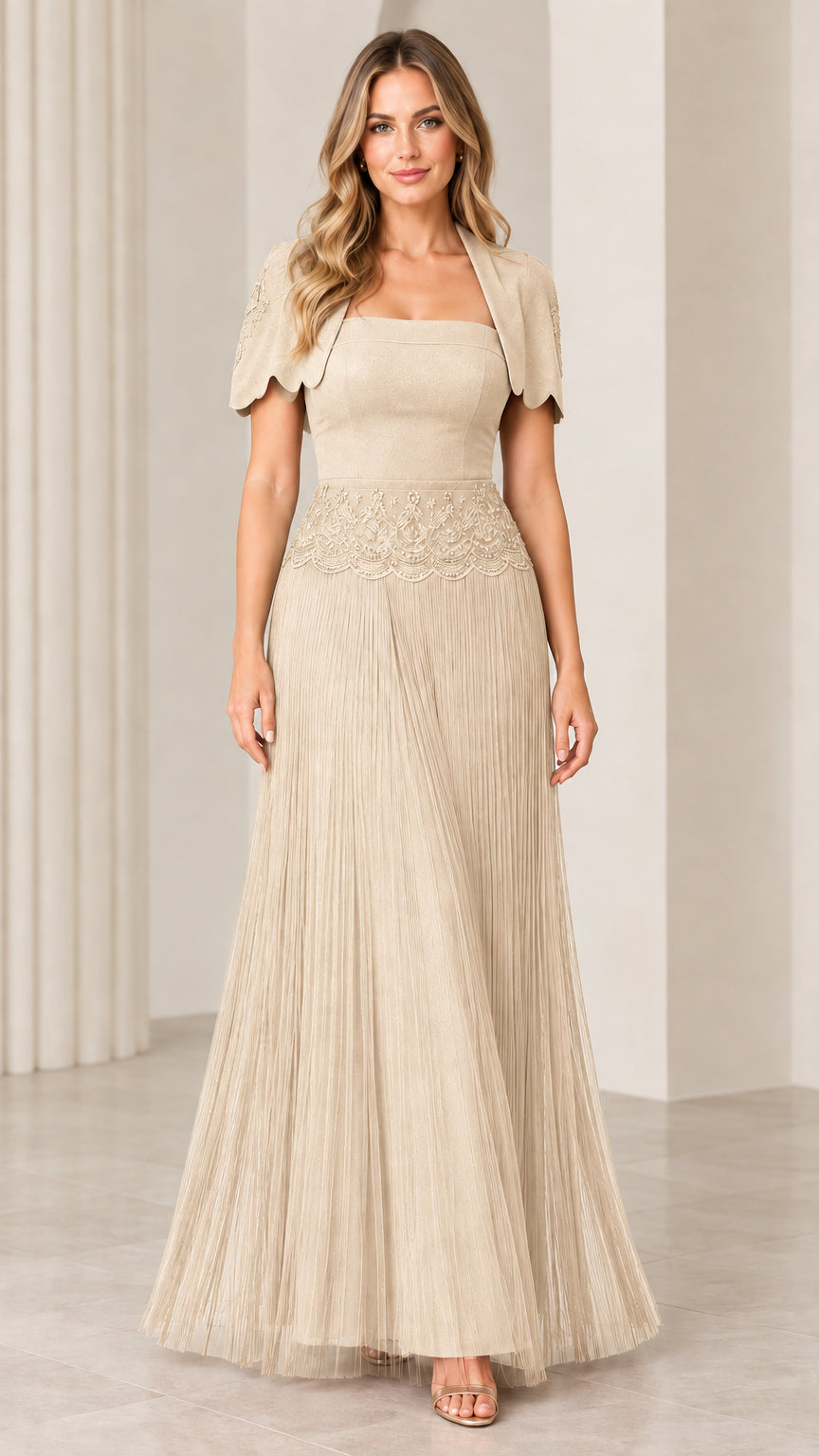 Front view of woman wearing champagne beige pleated maxi evening gown with bolero jacket