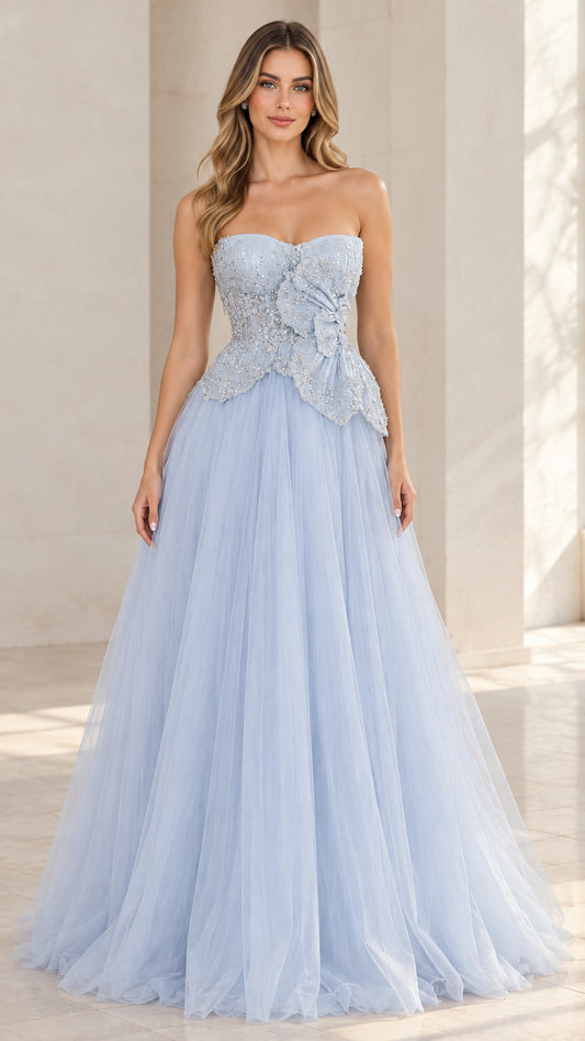 Front view of model wearing light blue strapless beaded tulle ball gown