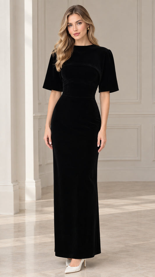 Front view of model wearing black short sleeve crew neck velvet maxi dress