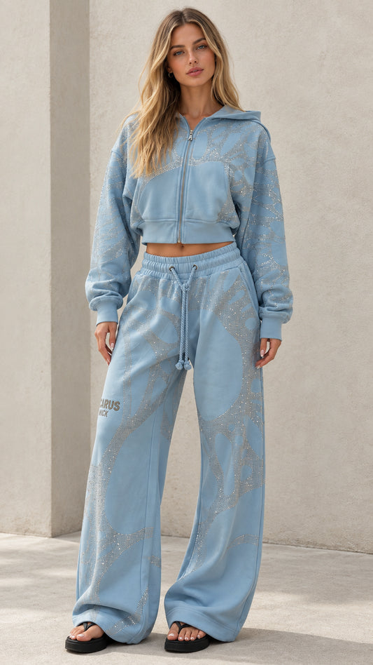 Front view of woman wearing Light Blue rhinestone cropped zip hoodie and wide leg sweatpants set