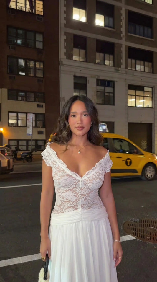 Woman wearing white lace scalloped V-neck maxi dress front view