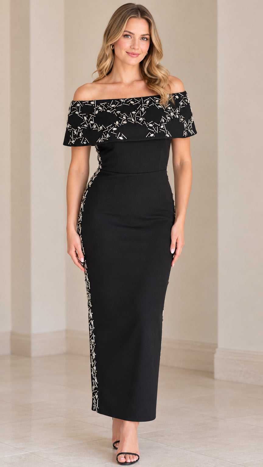 Front view of woman wearing off-the-shoulder beaded black column maxi dress
