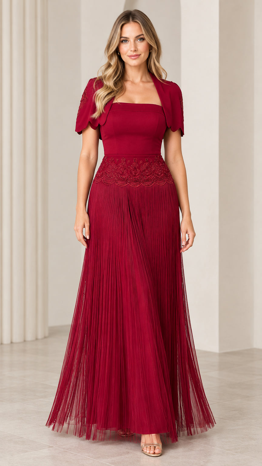 Front view of woman wearing burgundy square neck pleated maxi formal gown with embroidered bolero jacket