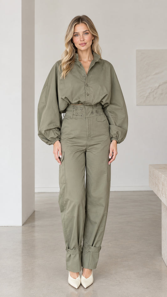 Front full-length view of woman wearing olive green lantern sleeve cargo jumpsuit