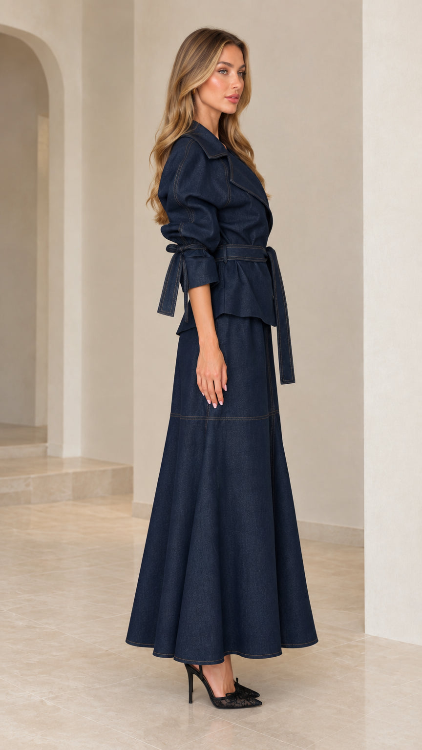 Side profile view of dark navy blue two-piece jacket and maxi skirt outfit