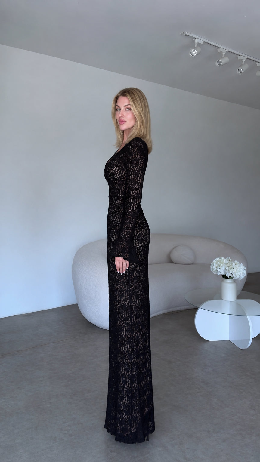 Side profile view of black long sleeve lace evening maxi dress