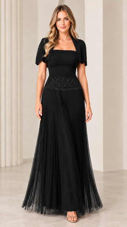 Front view of woman wearing black pleated maxi evening dress with matching bolero jacket