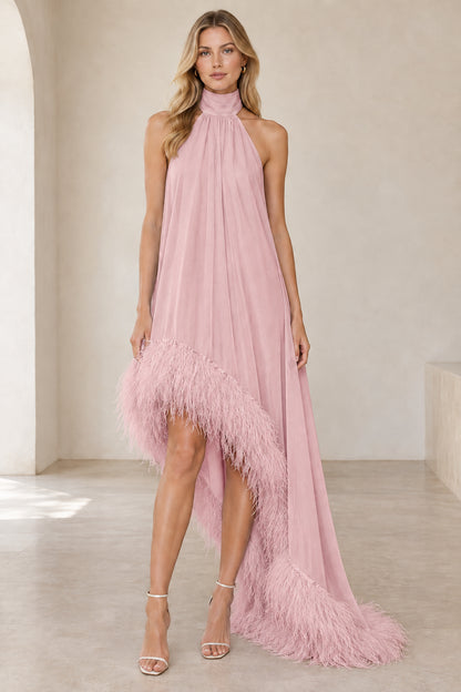 Model wearing blush pink halter high-low gown with matching feather trim