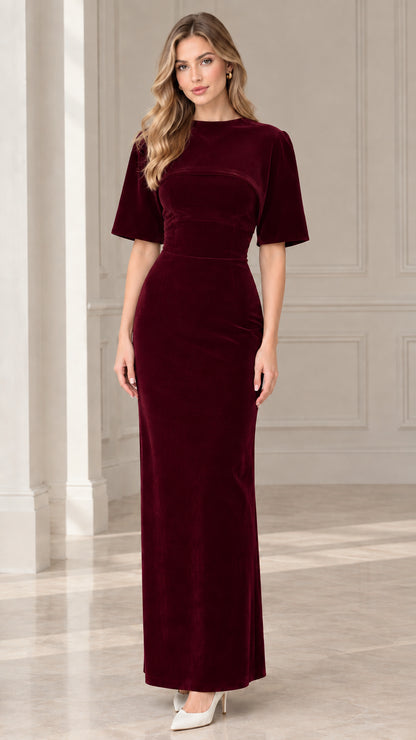 Model wearing burgundy wine red short sleeve velvet formal dress