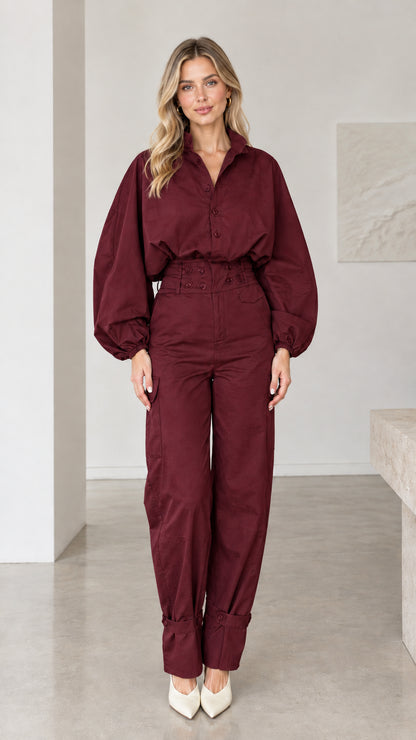 Front view of woman wearing burgundy wine red collared cargo jumpsuit